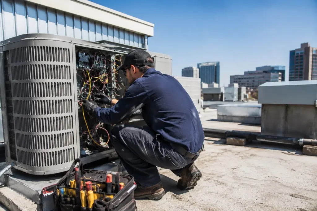 Commercial HVAC units installed on a flat commercial rooftop